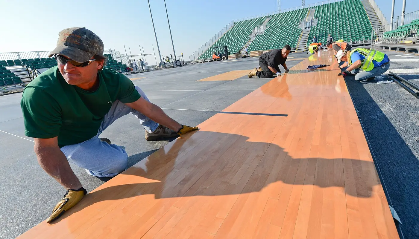 Flickr Official U.S. Navy Imagery Construction workers assemble a basketball court aboard USS Bataan.